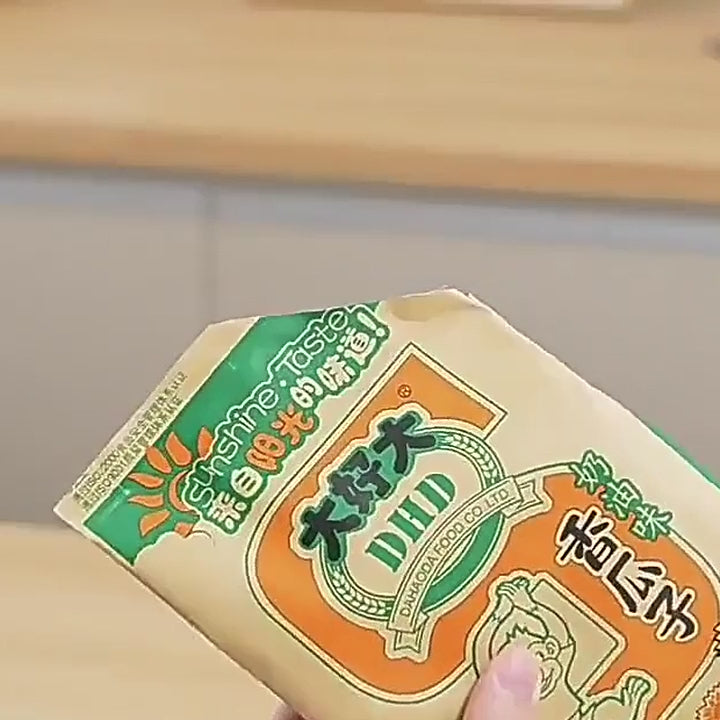 Pulling at a resealed snack bag to show the sealed edge holds